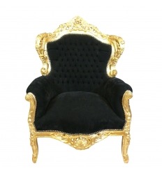 Musta barokki nojatuoli ja kultaisesta puusta