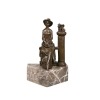 Bronze statue of a woman sitting on a balustrade - 