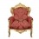Red baroque armchair and gilded wood