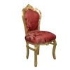 Red baroque chair and gilded wood