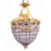 Araña en bronce y cristales estilo Luis XVI.